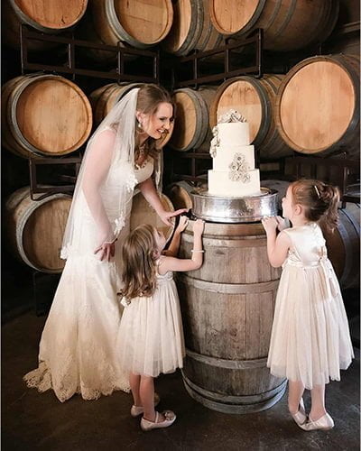 Wine Barrels Bride with her Flower Girls